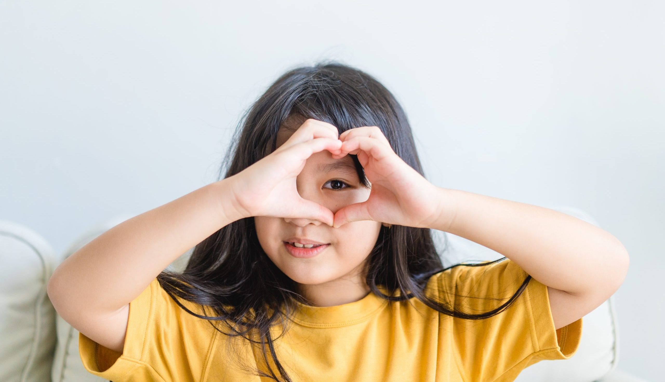 Healthy,Eyes,And,Vision.portrait,Happy,Asian,Kid,Child,Holding,Heart